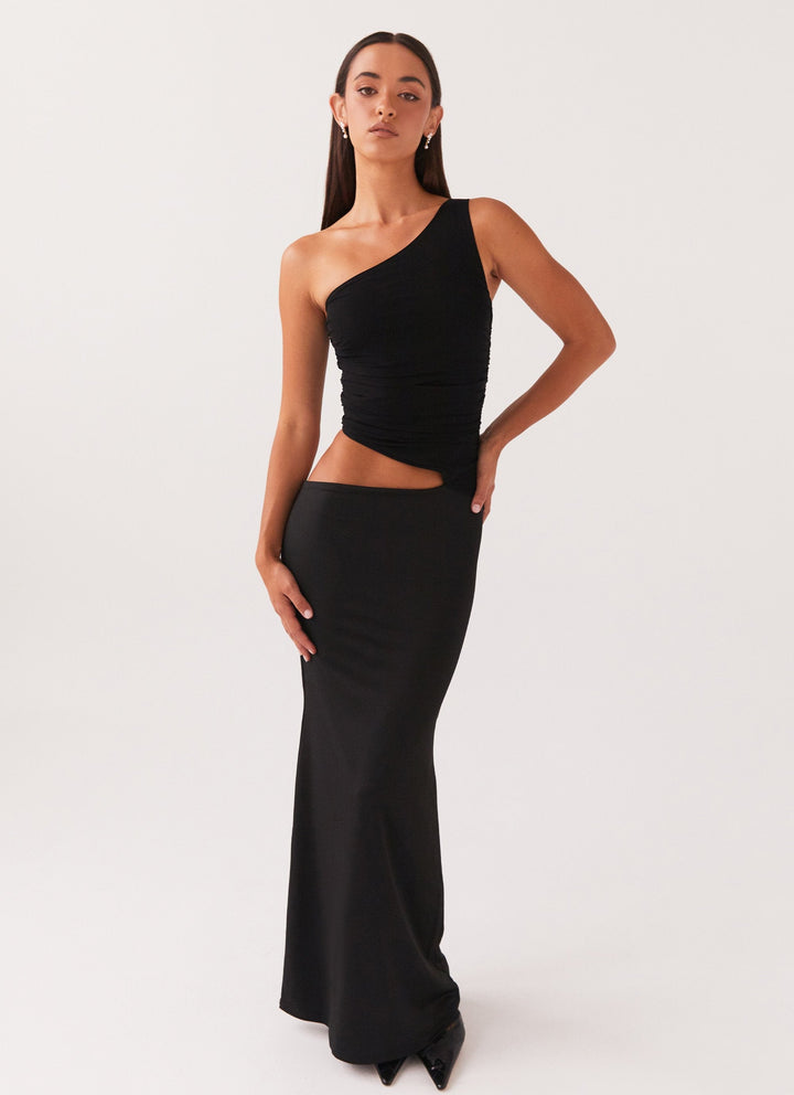 Long dress with one shoulder design and cut-out detail