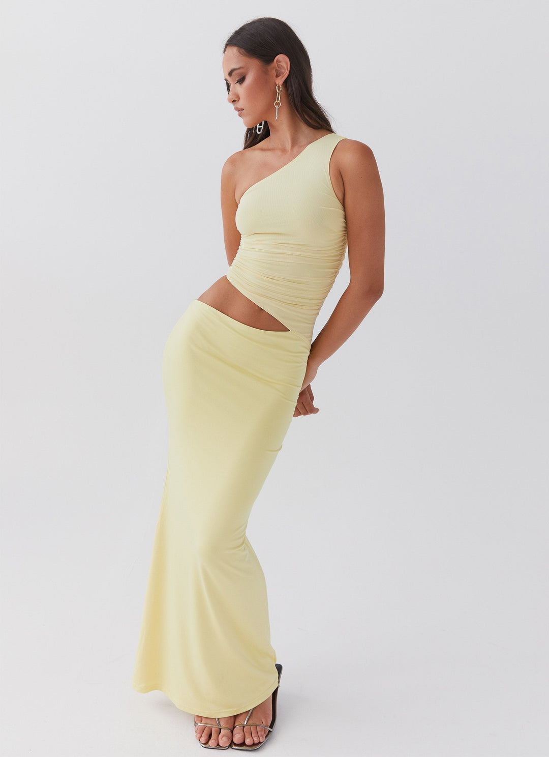 Long dress with one shoulder design and cut-out detail