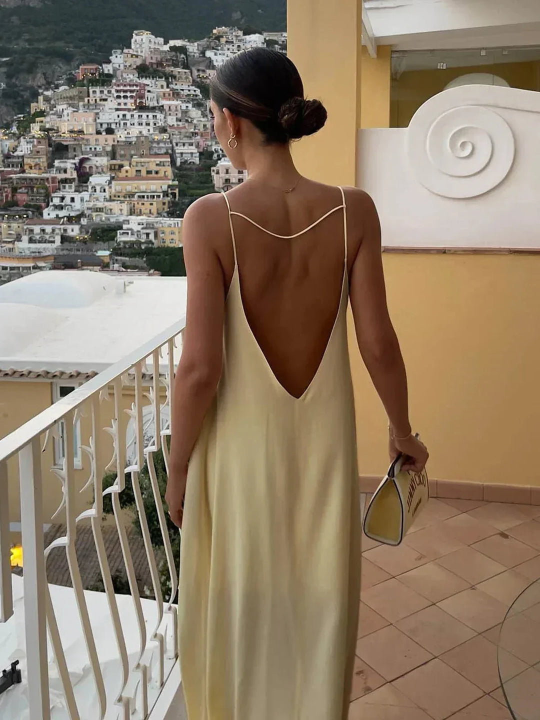 Long yellow backless dress for summer beach relaxation