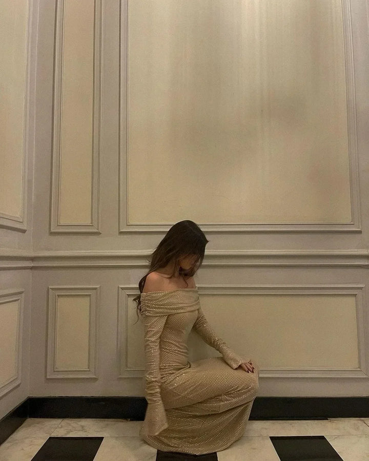 Long Shimmering Dress with Long Sleeves and Off-Shoulder Design