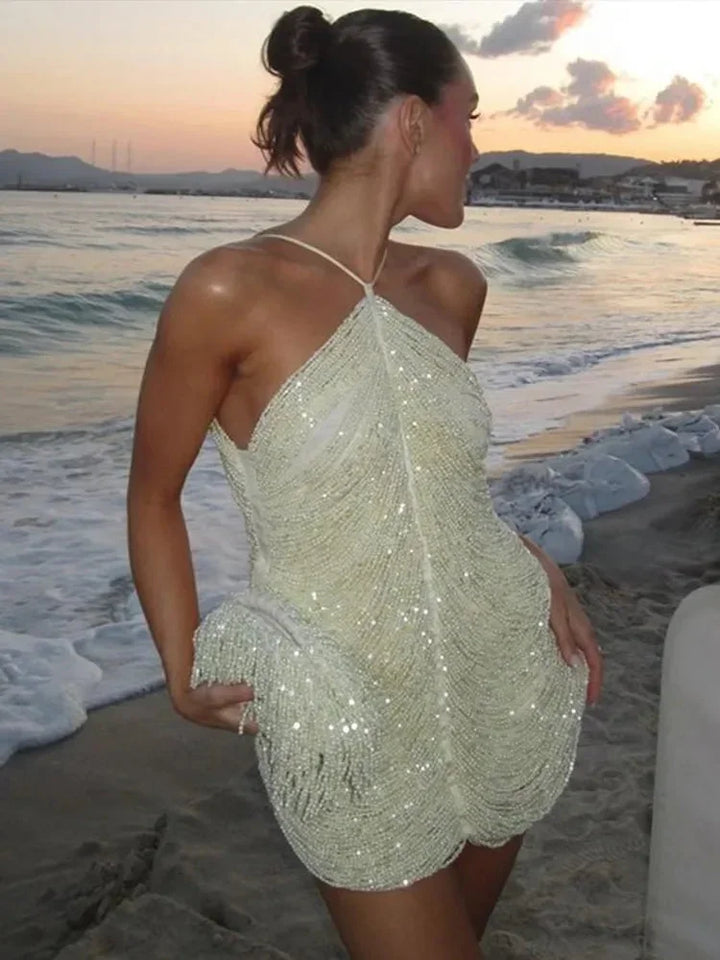 Short women's cocktail dress with sequins and halter neck
