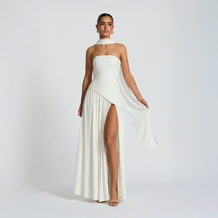 Strapless long dress with asymmetric cut and high slit